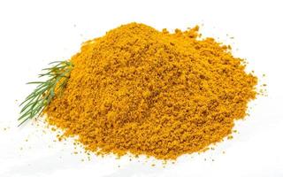 Curry powder on white background photo