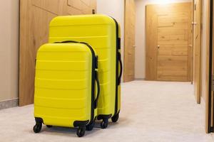 Yellow suitcases in a hallway. photo