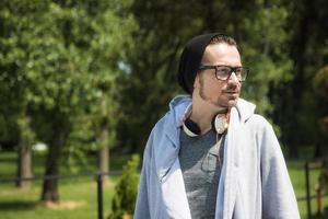 Man with headphones in the park. photo