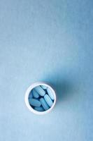 Medicine tablets in a bottle. photo