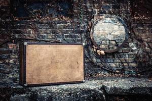 Leather suitcase against the wall. photo