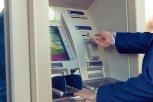 Withdrawing money at ATM. photo