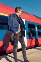 Below view of man standing by the train. photo