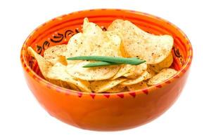 Potato chips in a bowl on white background photo