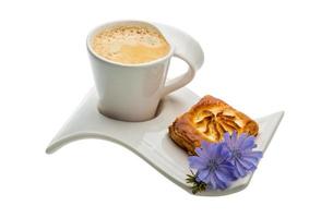 Coffee with pastry on white background photo