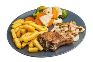 T-bone steak on the plate and white background photo