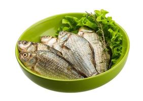 Crucian fish in a bowl on white background photo