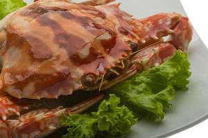 Red crab on the plate and white background photo