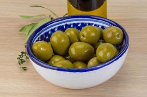 Marinated green olives photo