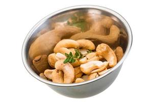 Cashew in a bowl on white background photo