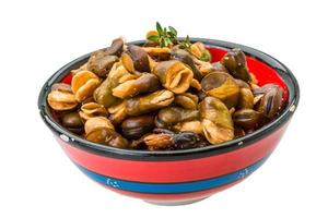 Broad beans in a bowl on white background photo