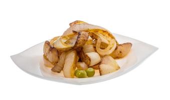 Fried onion on the plate and white background photo