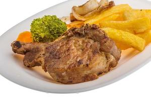 T-bone steak on the plate and white background photo