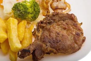T-bone steak on the plate and white background photo