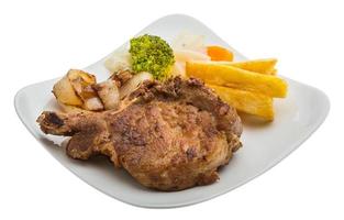 T-bone steak on the plate and white background photo