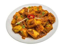 Alu Bengan on the plate and white background photo