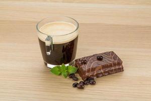 Coffe with cake on wooden background photo