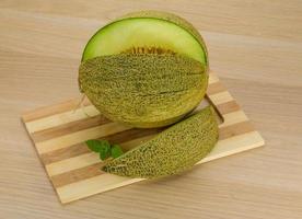 Melon on wooden background photo