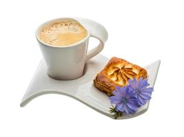 Coffee with pastry on white background photo