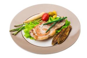 T-bone steak on the plate and white background photo