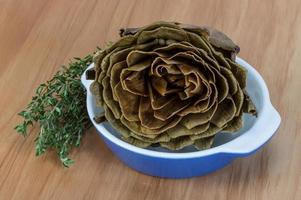 Boiled artichokes in a bowl photo