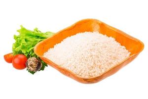 Rice in a bowl on white background photo