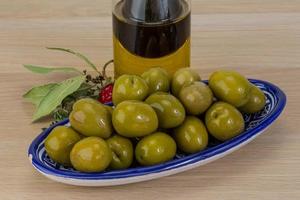 Marinated green olives photo