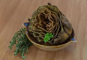 Boiled artichokes in a bowl photo