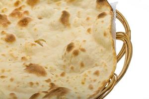 Plain Naan in a basket on white background photo