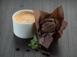 Coffee with muffin on wooden background photo