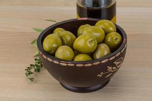 Marinated green olives photo