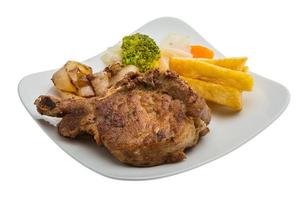 T-bone steak on the plate and white background photo