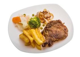 T-bone steak on the plate and white background photo