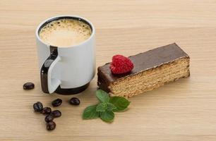 Coffee with cake on wooden background photo