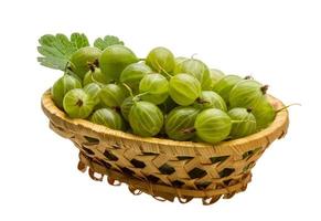 Gooseberry in a basket on white background photo