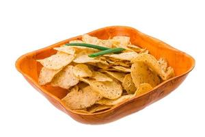 Potato chips in a bowl on white background photo