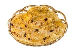 Pishwary naan in a basket on white background photo