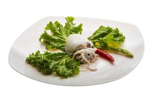 Boiled cuttlefish on the plate and white background photo