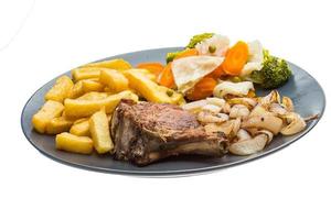 T-bone steak on the plate and white background photo