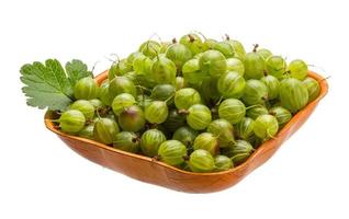 Gooseberry in a bowl on white background photo