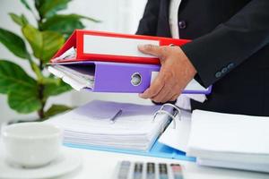 Business woman busy working with documents in office. photo