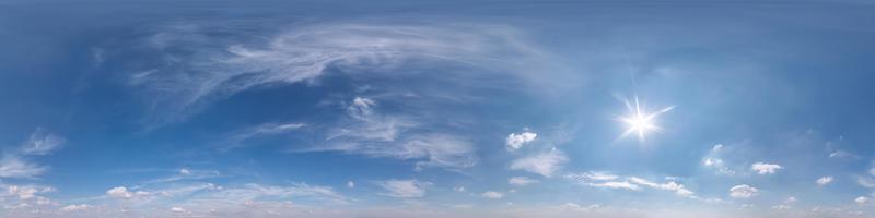 Seamless clear blue sky hdri panorama 360 degrees angle view with beautiful clouds  with zenith for use in 3d graphics or game as sky dome or edit drone shot photo