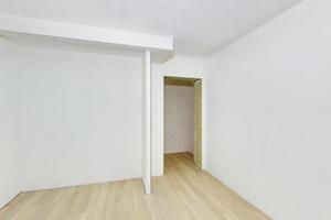 Empty unfurnished room with minimal preparatory repairs. interior with white walls photo