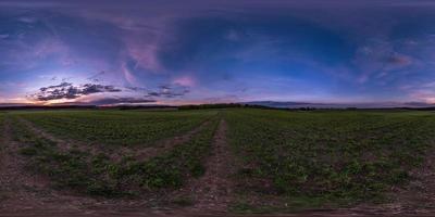 full seamless spherical hdri panorama 360 degrees angle view on asphalt road among farm fields in autumn evening before sunset with storm clouds in equirectangular projection, ready for VR AR content photo