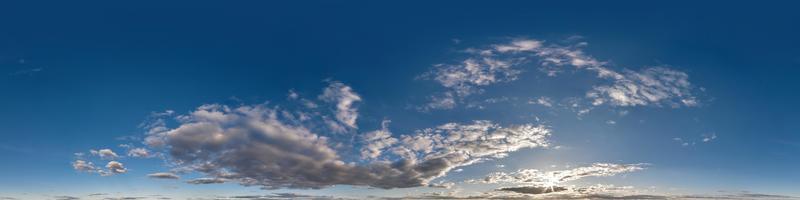 evening blue sky hdr 360 panorama with white beautiful clouds in seamless projection with zenith for use in 3d graphics or game development as sky dome or edit drone shot for sky replacement photo