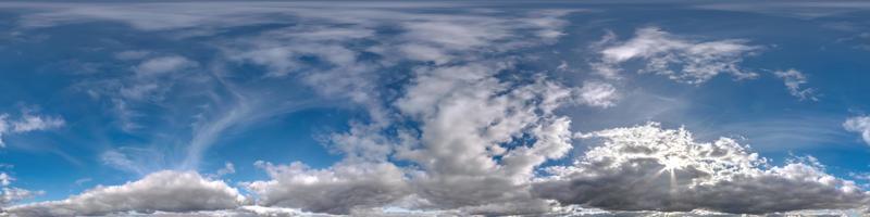 blue sky hdr 360 panorama with white beautiful clouds in seamless projection with zenith for use in 3d graphics or game development as sky dome or edit drone shot for sky replacement photo