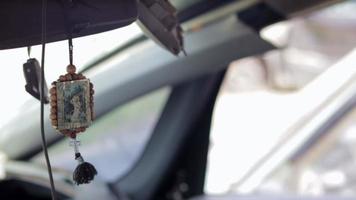 Wooden icon amulet in the car of Nicholas the Wonderworker on a string double sided. The icon is conveniently hung on the rearview mirror. Translation Seraphim of Sarov the Wonderworker. video