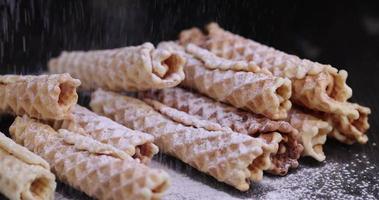 crispy waffles are sprinkled with white powdered sugar photo