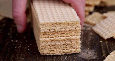 cut waffles on a wooden table, close-up photo