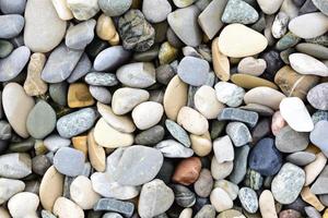 Background and texture of pebbles lying next to each other photo